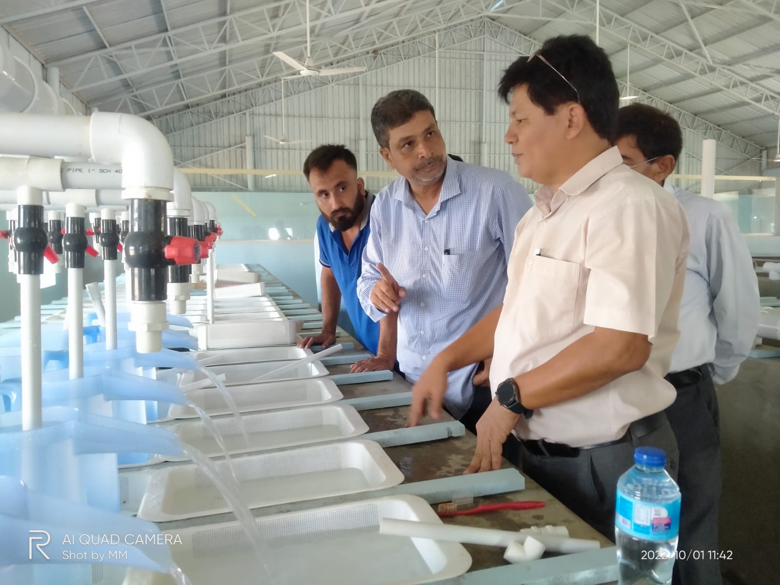 Group tour of the hatchery incubation system